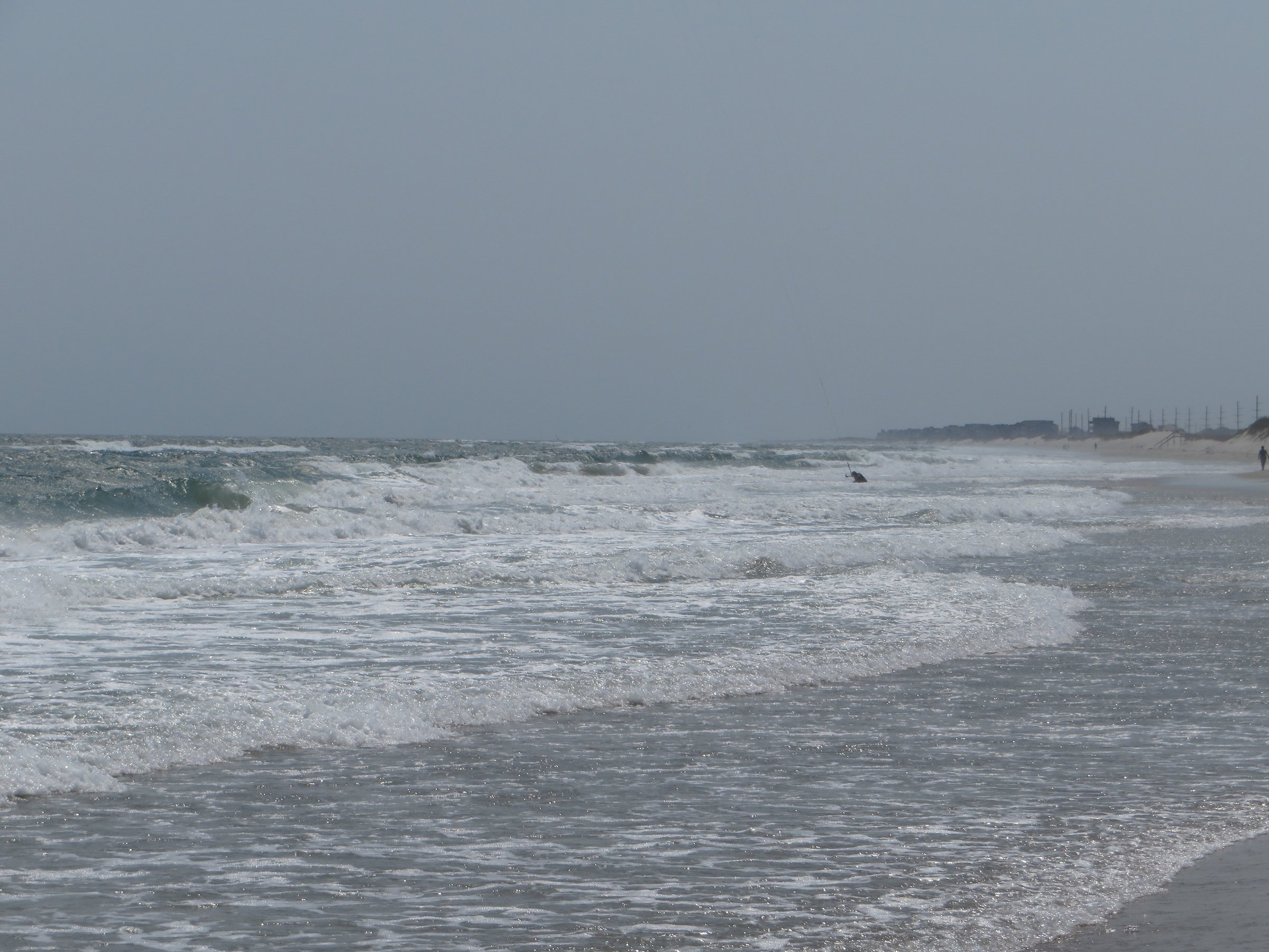 Wide beach and rolling surf along Cape Hatteras National Seashore near the village of Waves on Hatteras Island
