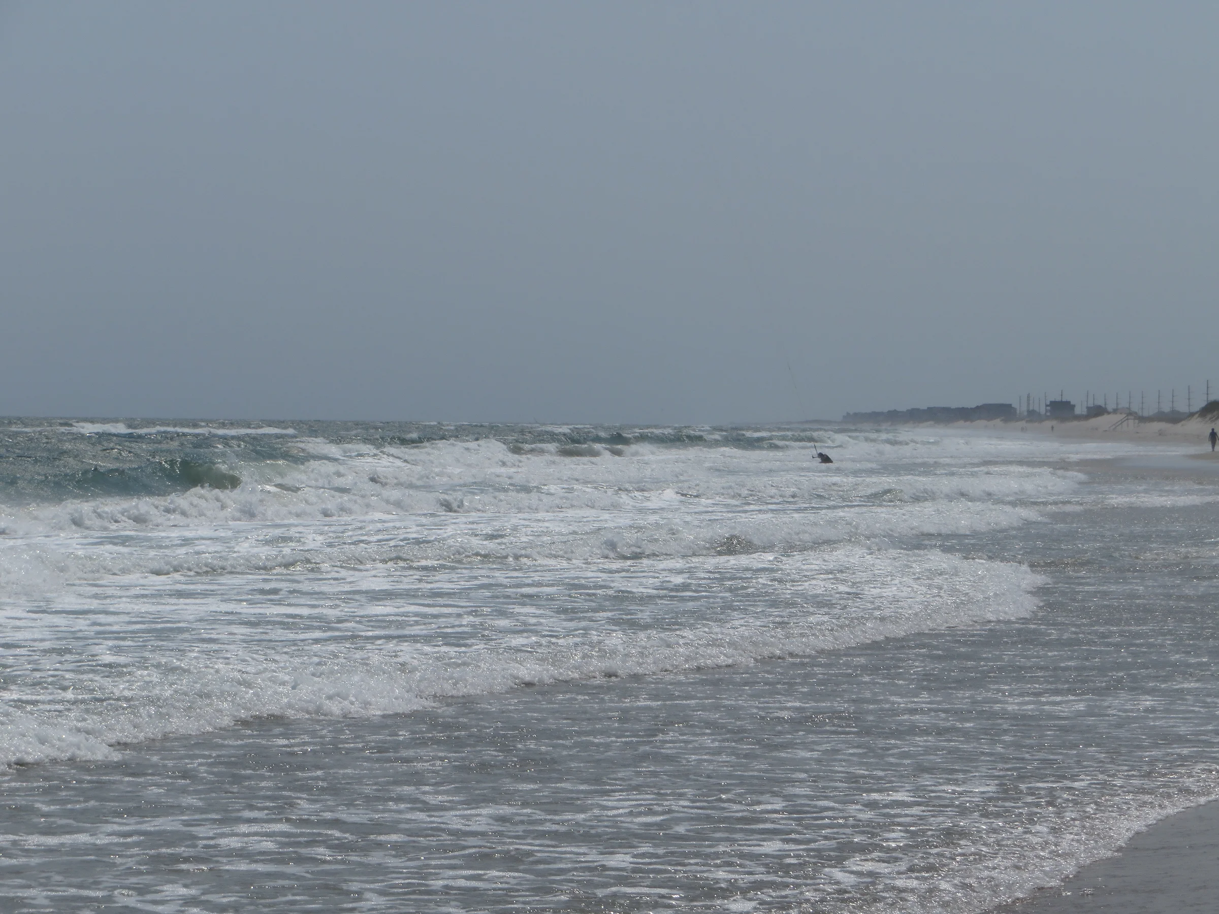 Wide beach and rolling surf along Cape Hatteras National Seashore near the village of Waves on Hatteras Island