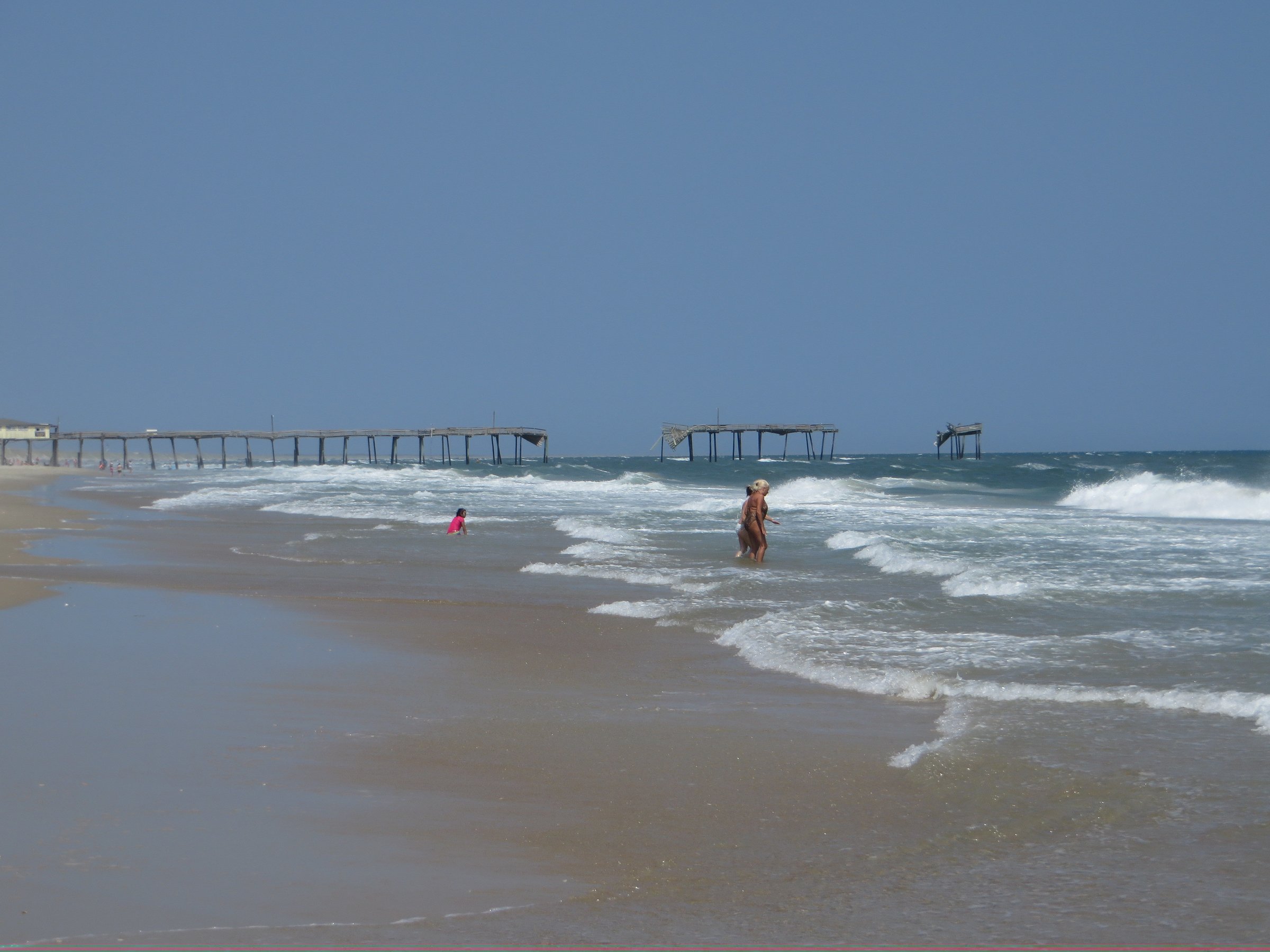 Remains of the wavy Frisco Pier extending into the Atlantic Ocean, destroyed by Hurricane Earl in 2010, at Frisco on Hatteras Island