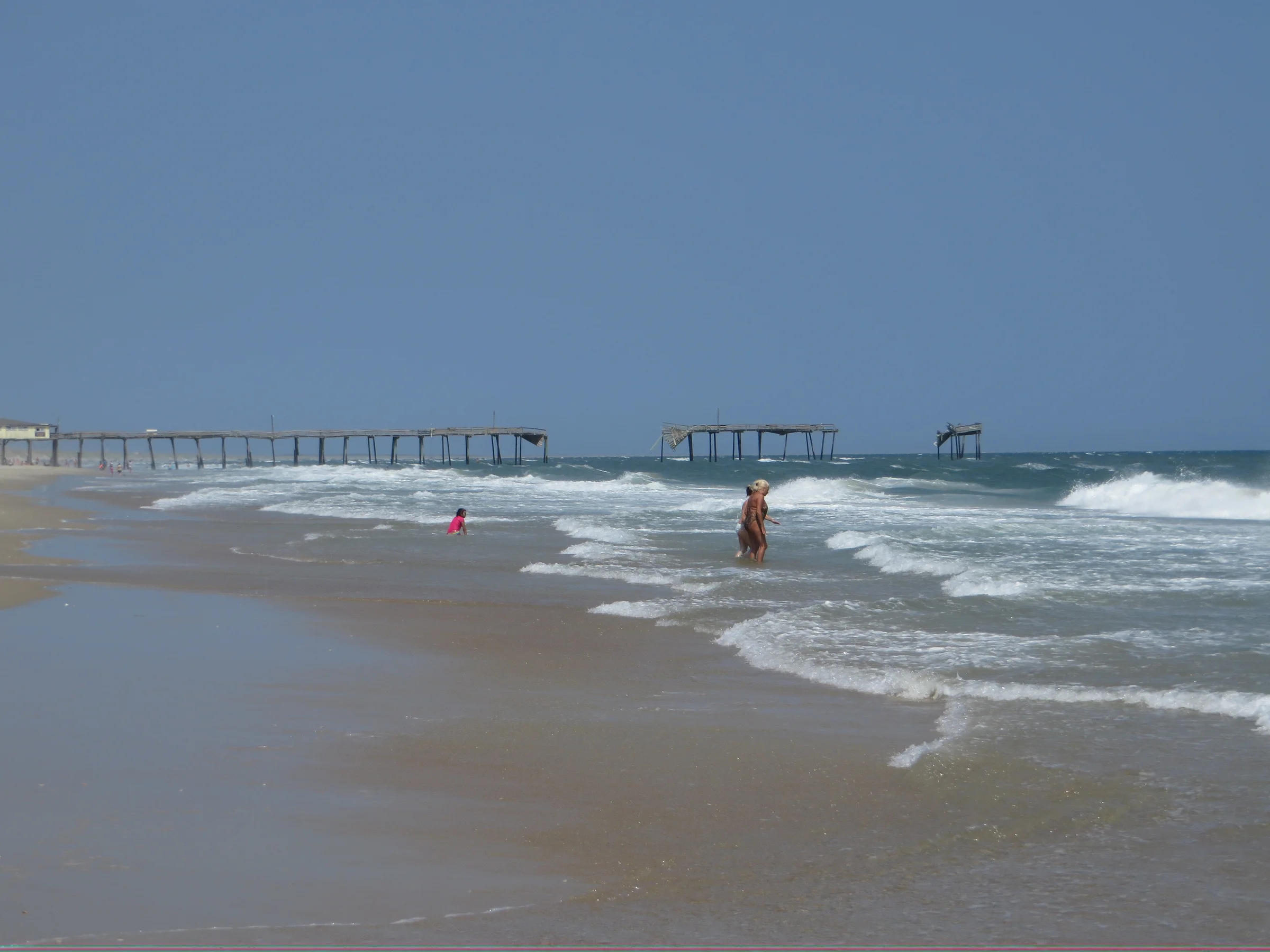 Remains of the wavy Frisco Pier extending into the Atlantic Ocean, destroyed by Hurricane Earl in 2010, at Frisco on Hatteras Island