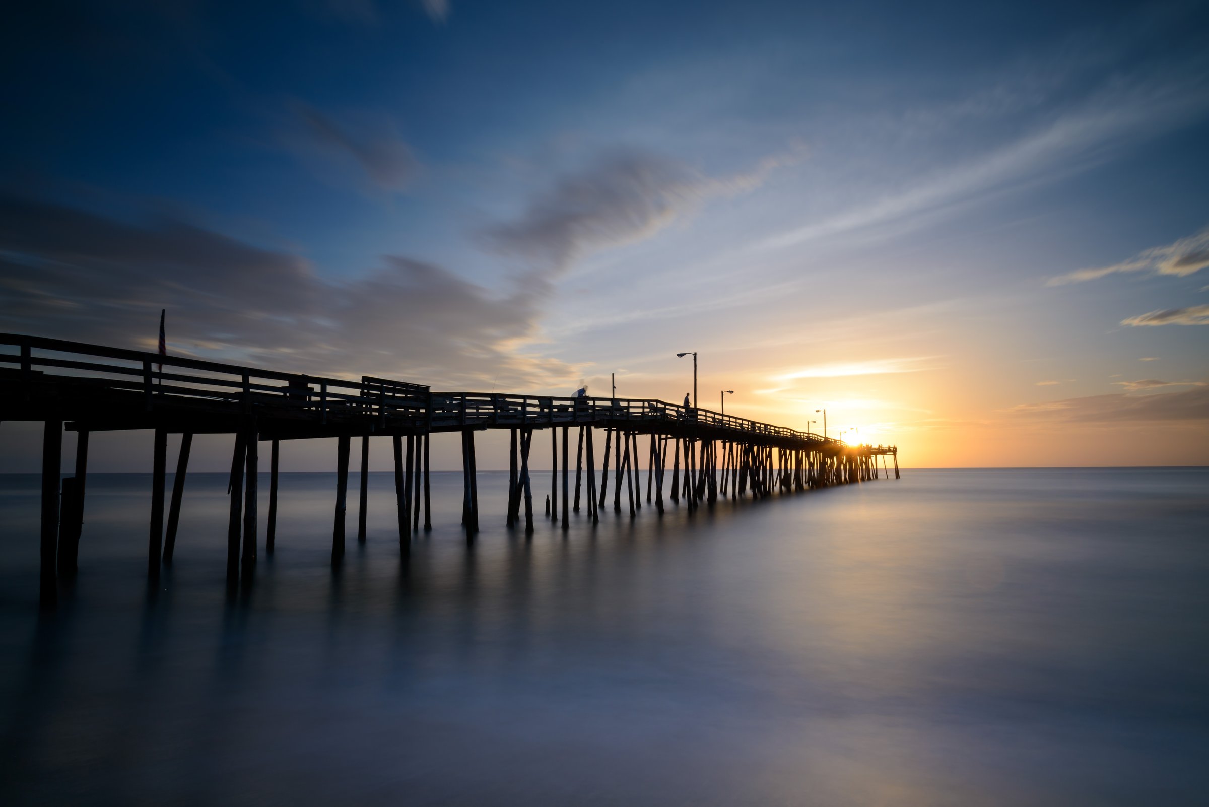 Nags Head Fishing Pier stretching into the Atlantic Ocean on a clear day