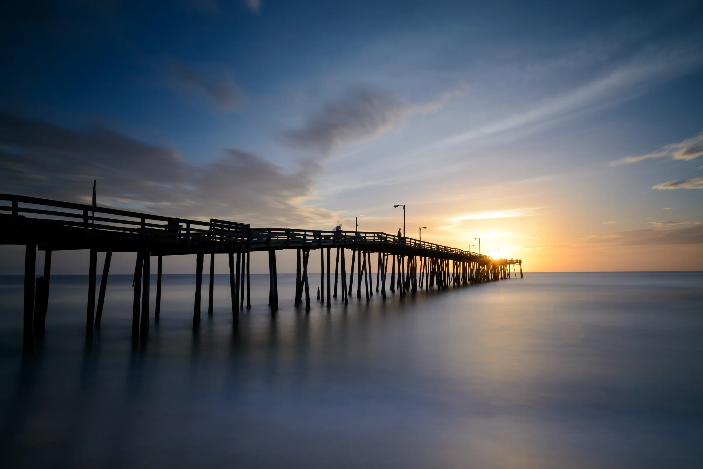 Nags Head Fishing Pier stretching into the Atlantic Ocean on a clear day